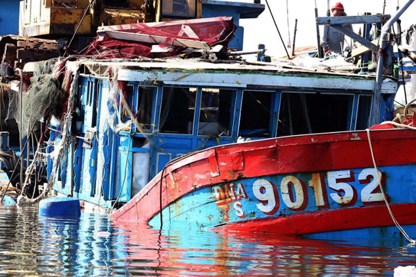 A Vietnamese fishing boat reportedly sunk by a Chinese ship sits in a shipyard in the central coastal city of Danang, June 2, 2014.