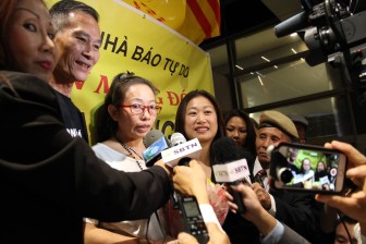 Dieu Cay (2nd left) was among the throng celebrating Ta Phong Tan's (3rd left) arrival at LAX as she was sent straight from prison to the U.S. (Photo: Uyen Vu)