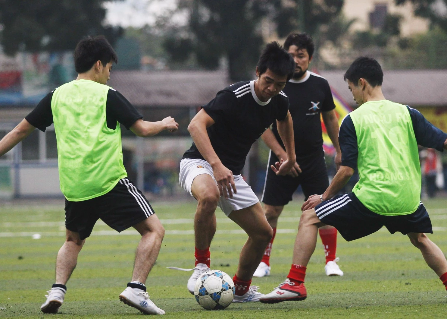 Nguyen Van Phuong , center, the captain and midfielder of the No-U FC soccer team, made up of Vietnamese anti-China protesters, controls the ball during a soccer match at a stadium in Hanoi. (Reuters)