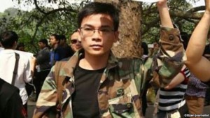 Mr. Dung at the green protest before being arrested in April 2015