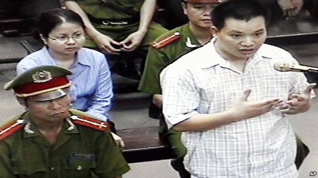 FILE - Nguyen Van Dai, right, testifies in this May 2013 file photo, originally taken from TV footage. The well-known Vietnamese human rights lawyer was arrested on anti-state "propaganda" charges.