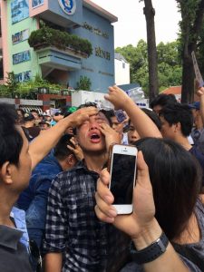 A protestor attacked with tear gas in Ho Chi Minh City on May 8, 2016